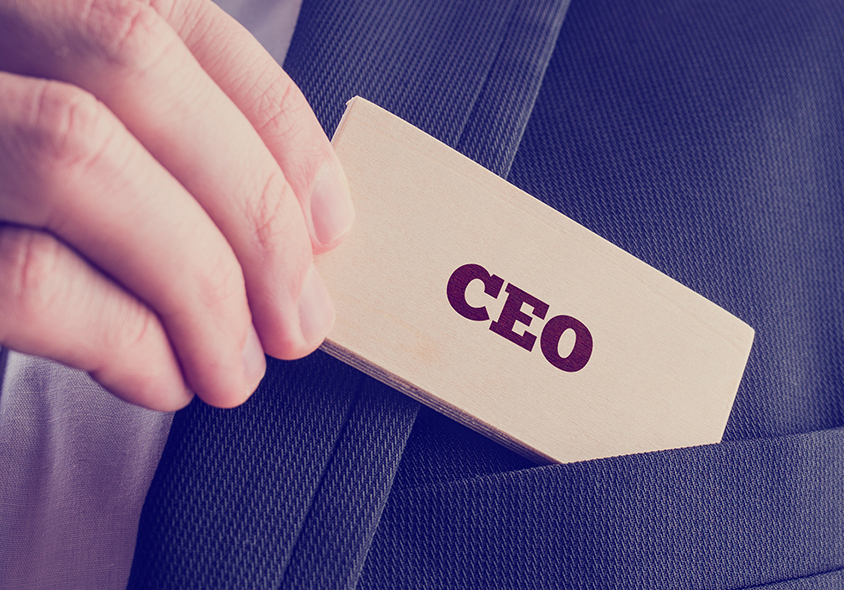 Businessman Showing A Card Reading CEO